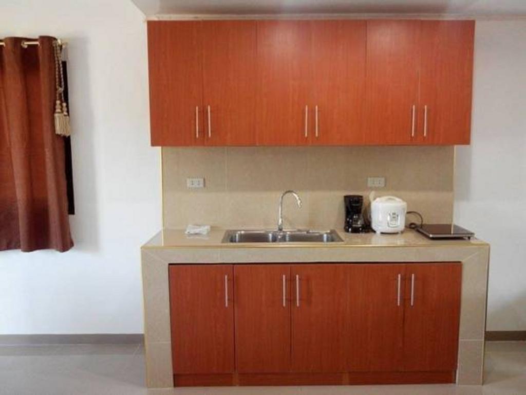 Rullan Apartelle Anda  Bilik gambar